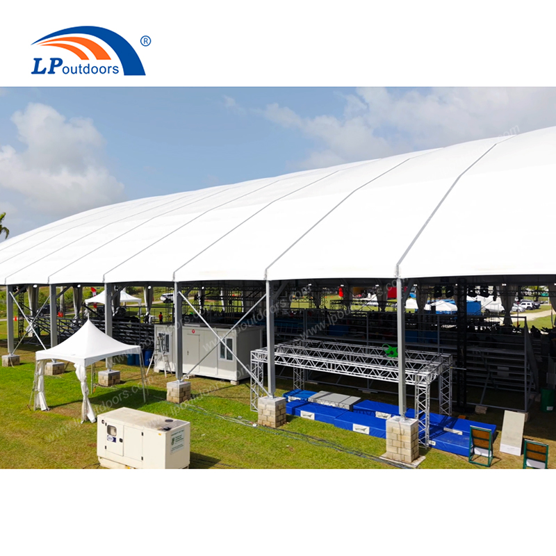 Large outdoor exhibition marquee structure on lawn