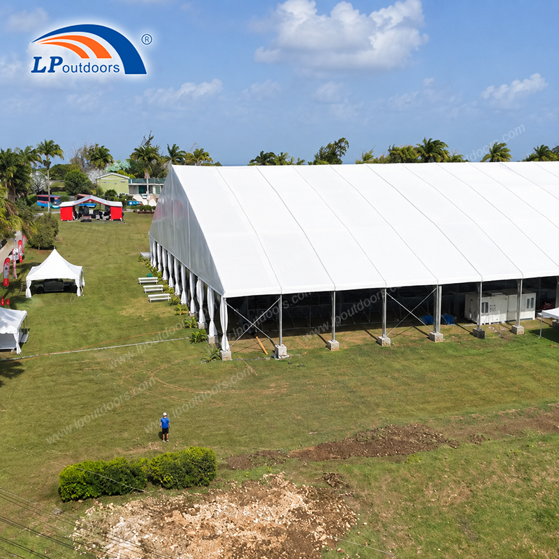 Large outdoor exhibition marquee structure on lawn